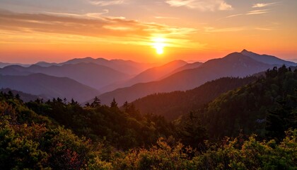 Obraz premium Majestic sunset over mountain peaks