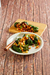 swiss chard rolls rolled with parsnips, butternut squash, potato, and bacon