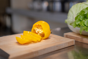 Sliced Yellow Bell Pepper on Wooden Cutting Board