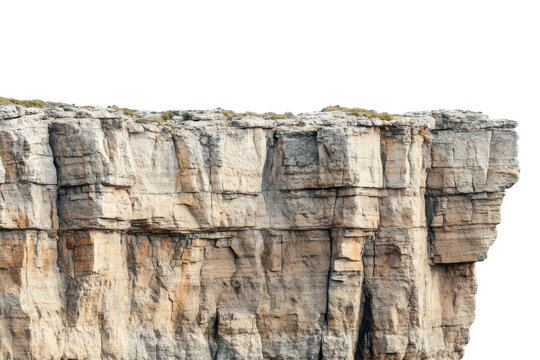 Rugged limestone cliff face with stratified layers and sparse vegetation isolated on transparent background