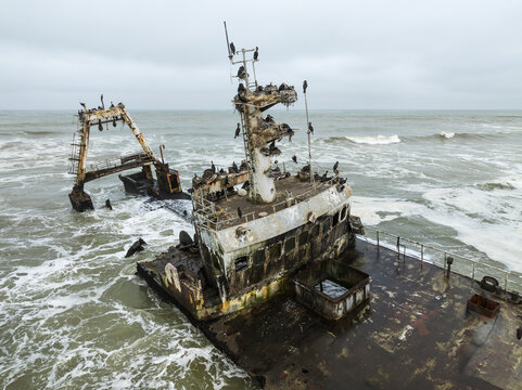 Aerial view of the Zeila shipwreck, a haunting relic on the Skeleton Coast, battered by the Atlantic's relentless waves, Zeila shipwreck, Erongo Region, Namibia.