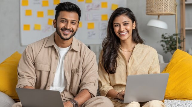 young indian couple working on laptop - Powered by Adobe