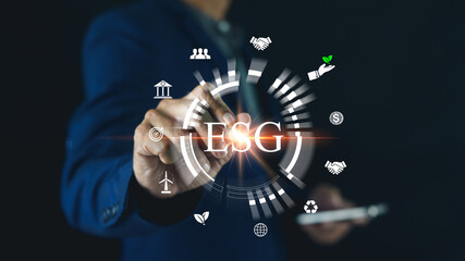 A person in a suit interacts with a digital interface displaying ESG (Environmental, Social, Governance) icons and symbols related to sustainability and corporate responsibility.