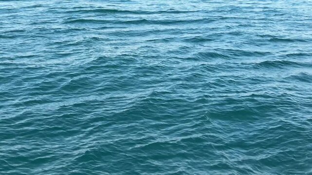 Blue sea water surface background.