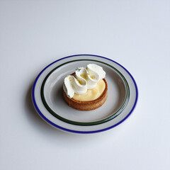 A Delicious Lemon Tart Topped with Soft Cream