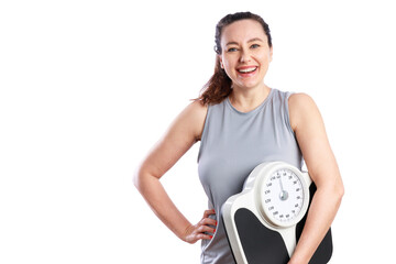 Smiling woman holding bathroom scale. Healthy eating, fitness and weight loss concepts