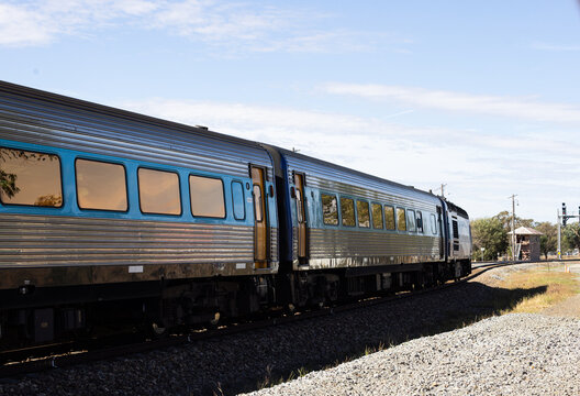 Looking along train and tracks at a rural train station
