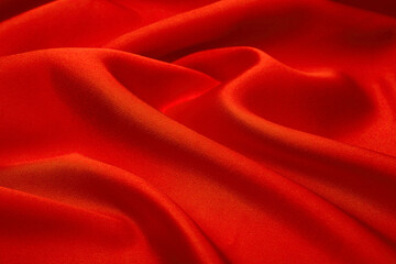 Elegant deep red satin fabric with soft flowing folds and a rich glossy sheen. Perfect for luxury branding, fashion design, romantic themes, and premium visual projects.