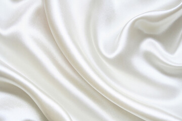 Obraz premium Elegant white satin fabric with soft folds and silky sheen. Ideal for bridal themes, luxury branding, fashion design, minimalist backgrounds, and premium visuals.