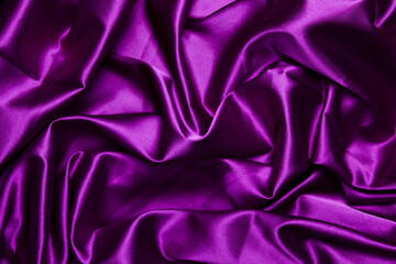 Rich purple satin fabric with smooth, glossy folds. Perfect for luxury branding, fashion design, elegant backgrounds, beauty visuals, and premium textile projects.