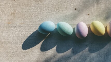 Obraz premium Five hand-painted pastel eggs in light blue, green, purple, yellow,