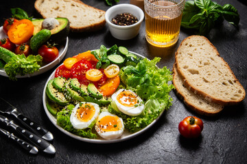 Healthy Salad Bowl with Avocado, Eggs, Tomatoes and Cucumbers,	