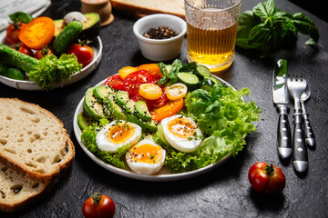 Healthy Salad Bowl with Avocado, Eggs, Tomatoes and Cucumbers,	