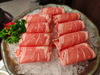 raw slice of beef meat on the ice ready for cooking
