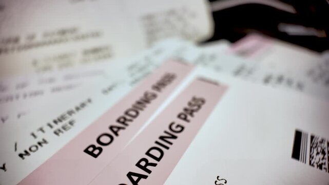 Close look at boarding passes, critical for airline travel and personal identification.