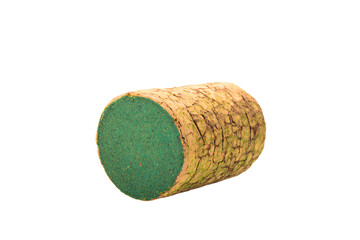 a green and brown cork covered object on a white surface