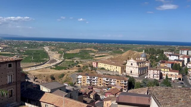 Urban panorama of Rossano Calabro. The Ionian Sea in the distance.