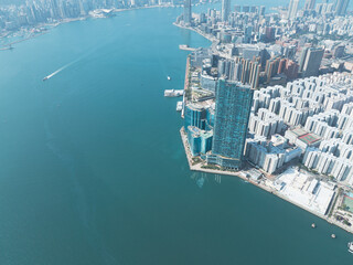 Aerial view of central Hong Kong, China. Dense cityscape meets the waterfront with numerous...