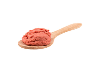 a wooden spoon with a scoop of food on it