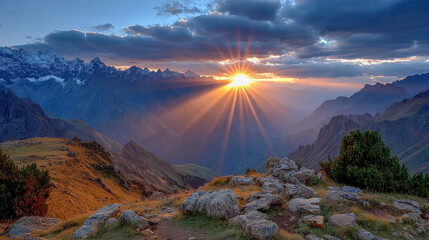Obraz premium Sunrise breaks over majestic mountain ridges, casting radiant beams of light through layered silhouettes