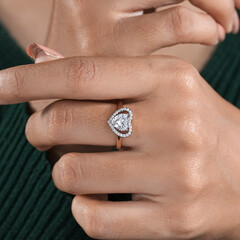 woman elegant finger ring with white diamond