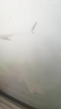 Passenger's point of view upon arrival in Panama on a rainy day.