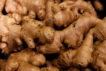 Rich and Earthy Fresh Ginger Root, a Culinary Staple Used in Various Dishes, and Renowned for its Health Benefits Including Anti-Inflammatory Properties and Digestive Aid