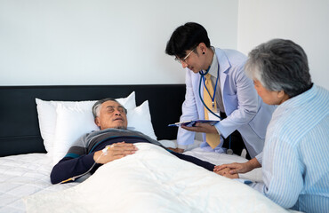 Fototapeta premium doctor explaining medical treatment for bedridden patient elderly hopeless senior man lying on bed. home caregiver nurse visit retirement patient for health check up recovery process medical service