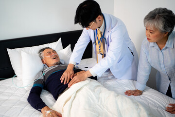 scene of doctor checking bedridden patient's stomach. illness senior man with infectious disease. home caregiver nurse visit retire couple for health check up recovery process medical service