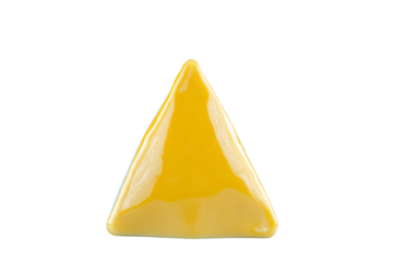 a yellow triangle shaped object on a white surface