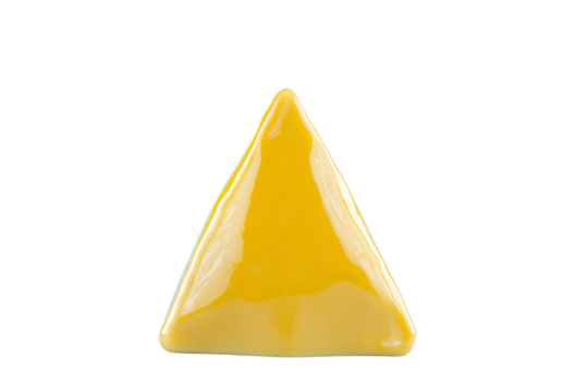 a yellow triangle shaped object on a white surface