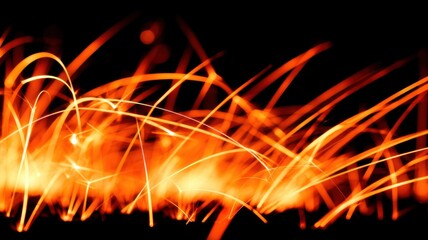 Bright orange sparks fly from metal friction or cutting, glowing vividly against a dark background,
