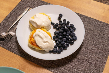 Home made cheesecakes with sour cream and blueberries. Food