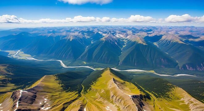 Breathtaking aerial view showcasing the majestic mountain ranges with flowing river under a clear