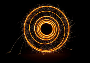 Golden shiny sparks of spiral wave on a black background. Curved bright speed line swirls. Shiny wavy path. Rotating dynamic neon circle. Magic golden swirl with highlights. Glowing swirl bokeh effect