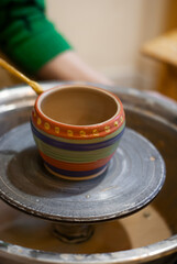 Glazing and painting clay vase 