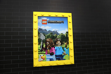 Fototapeta premium Lego Minecraft Movie poster with brick background and copy space