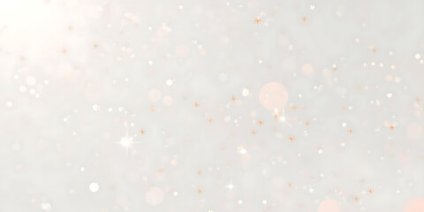 The image features a dreamy, delicate, and lightly dispersed magical effect, with a minimal white background scattered with small orange sparkles and soft light particles.