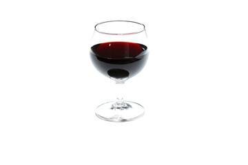 a glass of wine with a black dot on the bottom