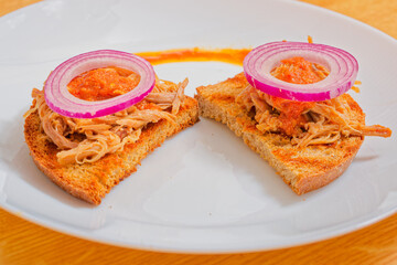 Pulled pork meat on bread