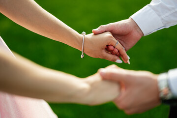 Close-up of couple holding hands with a romantic and emotional connection