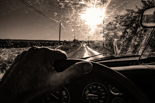 on the road vintage car  country road  country landscape convertible car dashboard sunnyday  end of the day roadtrip escape