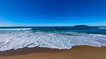 Stunning aerial view summer sandy sea beach wave, Foamy ocean waves, ocean breeze, Dreamy summer beach backgound. Ocean splash waves, travel vacation nature, Beautiful ​​view of the beach.