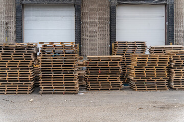 Stack of Wood pallets in front of loading dock