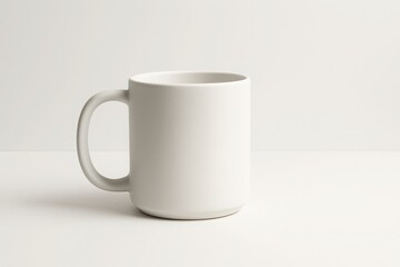 Obraz premium Minimal matte white ceramic mug on white background - perfect for product mockups, branding, merchandise visuals and lifestyle marketing.