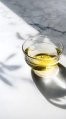 Elegant olive oil glass on marble surface kitchen setting still life photography natural light