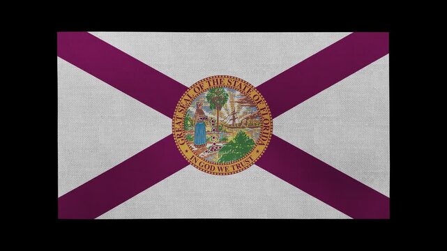 A Florida flag rolls and waves in front of a black background.
