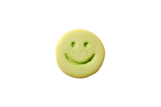 a smiley face cookie with a green icing - Powered by Adobe