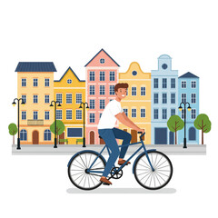 Fototapeta premium Man Riding Bicycle Through Colorful European City Street