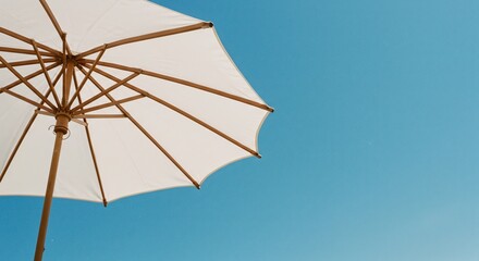 Opening a parasol under the blazing sun